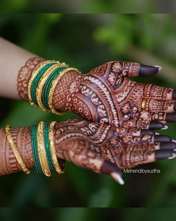 The final stain is the true reward of beautiful mehendi. I use only natural henna paste, which, with proper care, results in this deep, rich, reddish-brown color. This picture shows the gorgeous stain complemented by traditional green bangles.