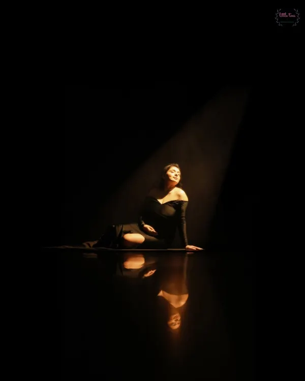 A dramatic spotlight portrait. This artistic, high-contrast style creates a powerful and timeless image that focuses entirely on you and your journey.
