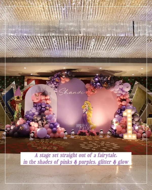 I absolutely loved bringing this Rapunzel fairytale to life for Shanvi's first birthday. We created a magical stage with towering balloon arches in pinks and purples, a light-up marquee number, and of course, Rapunzel herself, making it a truly immersive princess party.