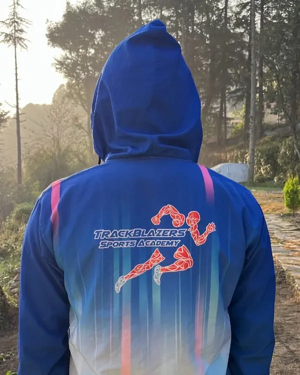 Representing Trackblazers Sports Academy against the stunning backdrop of our high-altitude training grounds. Our custom gear fosters a sense of unity and pride as our athletes push their limits together.