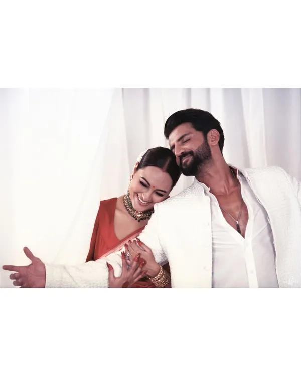 An analog film portrait of Sonakshi and Zaheer. The warmth of the film and their relaxed, happy embrace create a portrait that feels both timeless and incredibly personal.