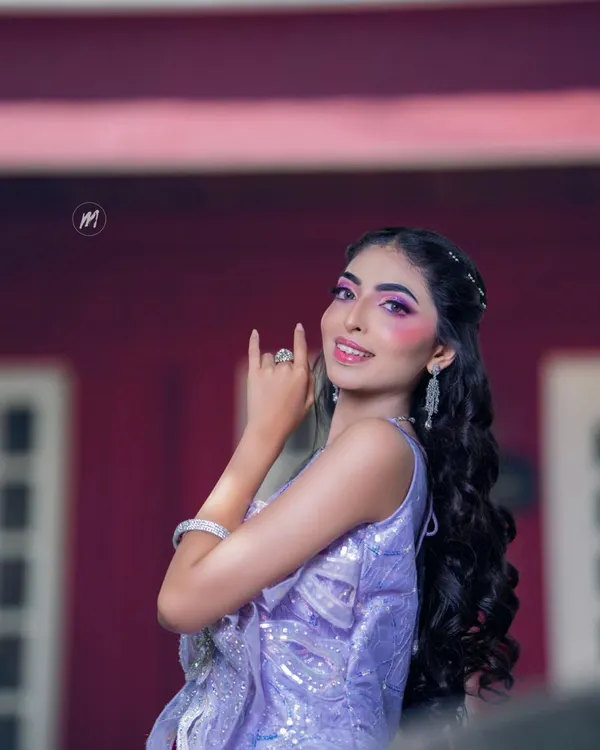 This is a full-on glam look I demonstrated for my students. It features dramatic purple-toned eye makeup and a glossy lip, paired with a sparkling lavender gown, perfect for a cocktail or reception night.