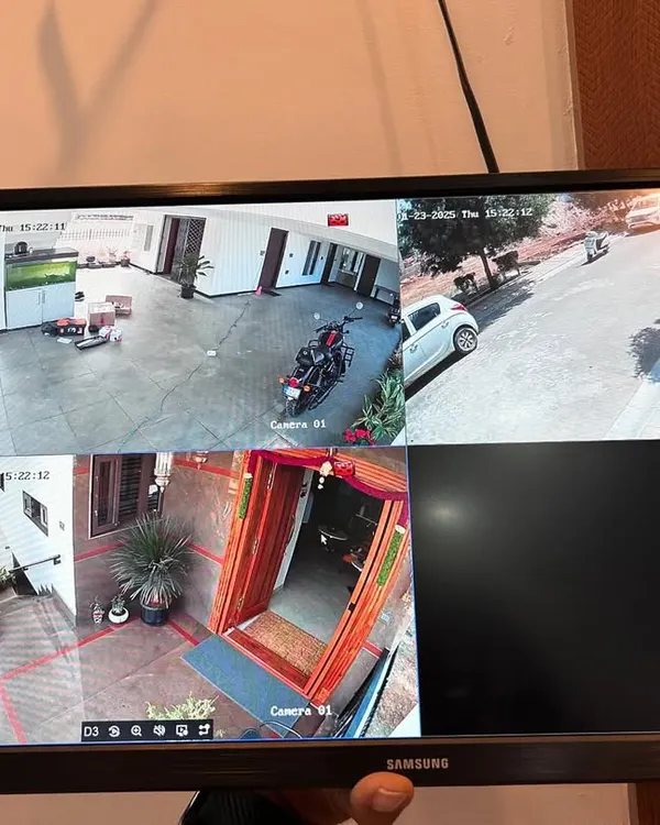 A multi camera view for a bungalow, showing the front gate, main door, and parking area. This setup ensures all entry points are monitored.