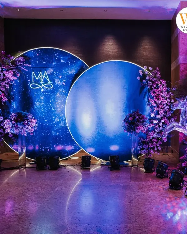 A stunning celestial-themed Sangeet I curated at the Grand Hyatt Mumbai. The deep blue backdrop with a custom monogram and starry lighting created an otherworldly atmosphere for the celebration.