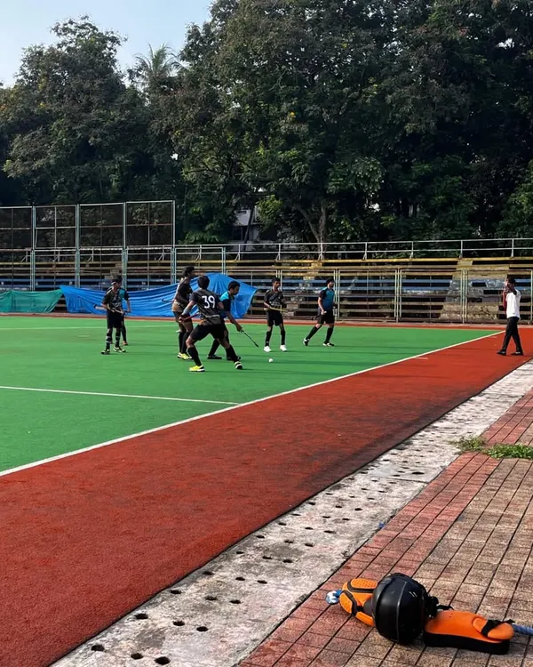 A wide shot of the action during our victorious match against Miraroad in the B.K. Mohite Memorial Hockey Tournament. Our team demonstrated excellent field coverage and strategic play.