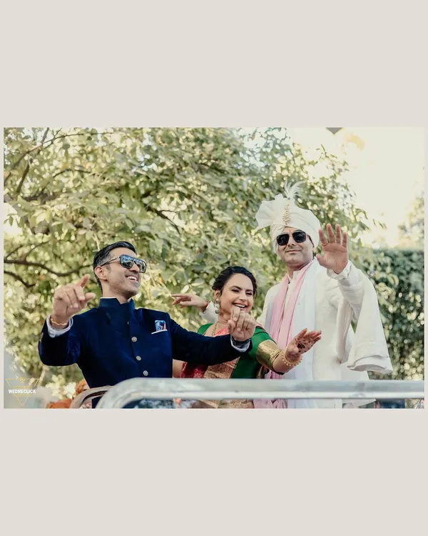 The groom's arrival in an open-top vehicle, full of smiles and energy. We capture the groom's happiness and style as he makes his way to the ceremony.