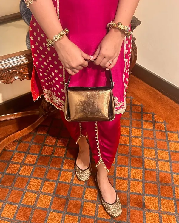 All your festive looks are sorted with my Mini Pochette bag and hand-embroidered Juttis from the Nazrana collection. This pairing is all about celebrating Indian craftsmanship with a touch of modern luxury.