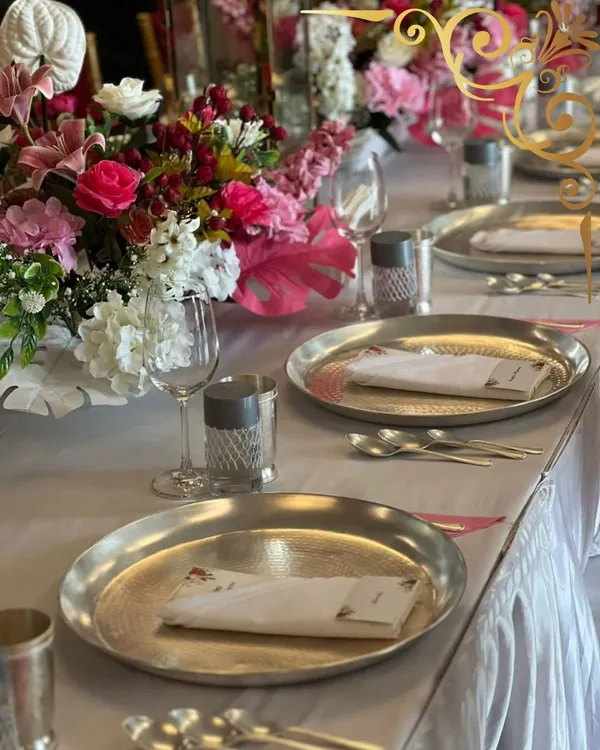 A beautifully set table is the first promise of a wonderful meal. I work to ensure the tablescape, with its vibrant flowers and elegant dinnerware, speaks the language of celebration.