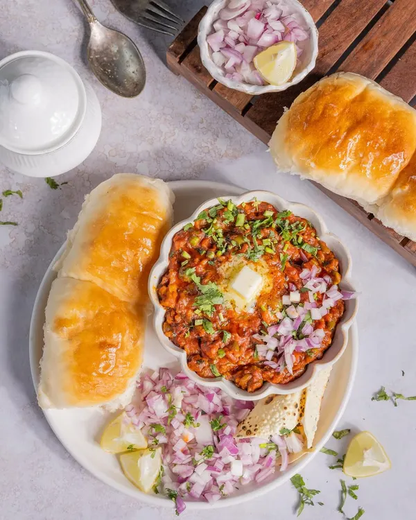 A classic Mumbai Pav Bhaji, served with extra onions and a dollop of butter that makes you want to dig right in.