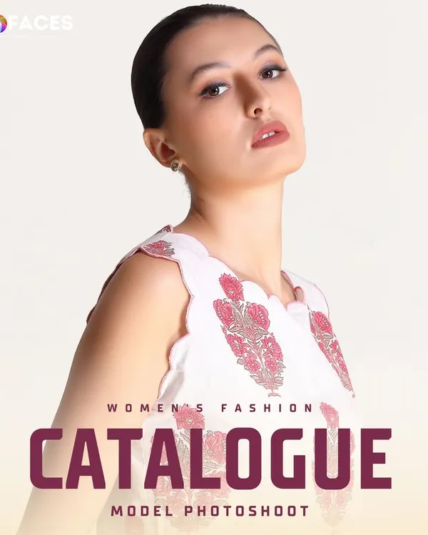 A strong, high-fashion pose from a model in a white printed top, perfect for a catalogue or portfolio headshot.