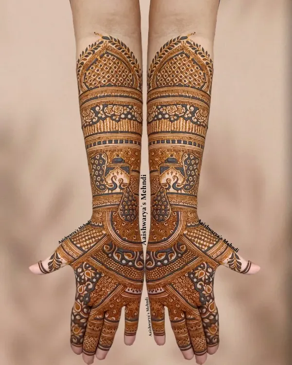 This is my signature full bridal mehndi style. I love creating these dense, symmetrical designs that cover the hands and arms, filled with traditional motifs like elephants and architectural details, to give you that truly royal bridal look.