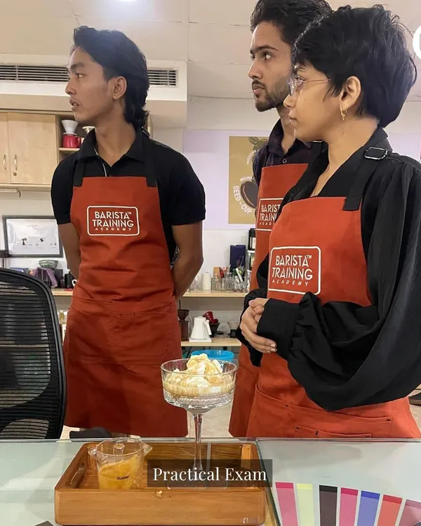 Students during their practical exam, putting their beverage creation and presentation skills to the test. Our flagship program culminates in assessments that mirror real-world cafe scenarios.