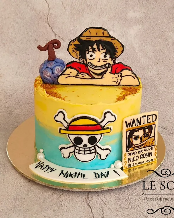 This One Piece cake was a blast to make, even if Luffy's hair was a challenge. This half-kg Cookies & Cream cake features Luffy, the Jolly Roger, a Devil Fruit, and a wanted poster, all hand-crafted.
