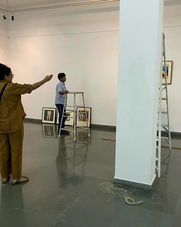 Here is curator Pushpamala N directing the team during the installation of Gulammohammed Sheikh's 'Hand Prints'. The process of curating is hands-on and collaborative.