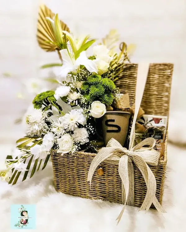 A sustainable trunk hamper filled with fresh white lilies, chrysanthemums, and gourmet goodies, specially curated for Google India and Mr. Sundar Pichai. This project highlights my ability to create sophisticated and thoughtful gifts for top-tier corporate leaders.