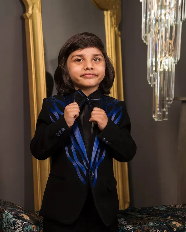 A close up of the blue satin wire detailing on the lapels of this custom tuxedo. I pair it with a matching bow tie to complete this sharp formal wear look.
