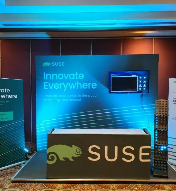 A complete exhibition stall designed for SUSE, featuring back-lit panels, a branded counter, and informational standees. I create functional and visually appealing booths that stand out on a crowded trade show floor.