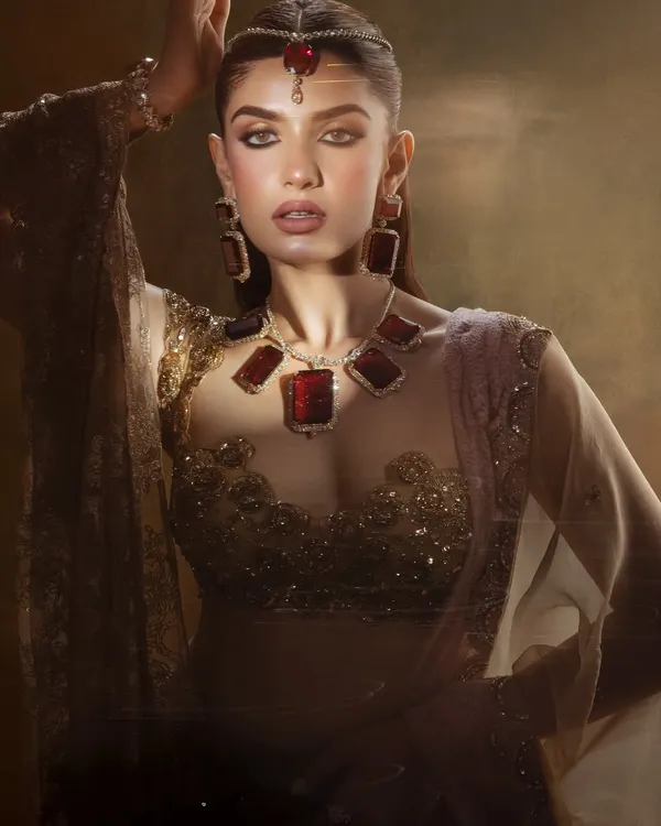 A Dream. This artistic shot from a campaign features a dramatic, smoky eye and bold ruby jewelry for a high fashion look.