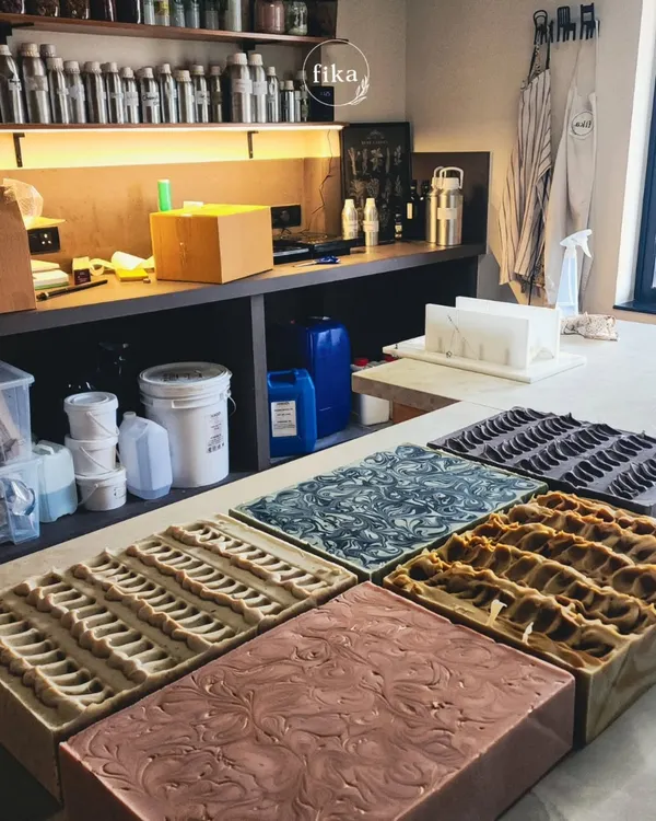 This is what production for my wholesale partners looks like. Multiple loaves, each with a unique design and formulation, are setting in my studio. I can handle bulk orders while ensuring every single bar meets my high standards for quality.