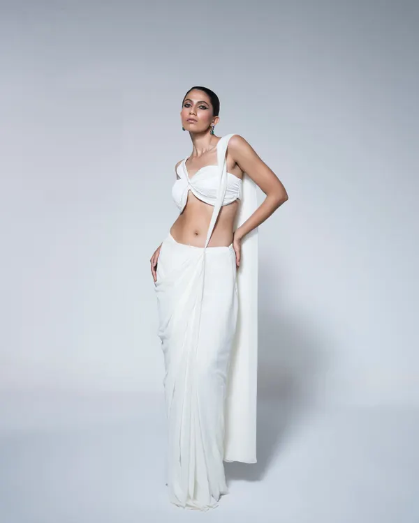 This look for House of R showcases my approach to modern, minimalist styling. The focus is on the innovative drape of the contemporary white saree and the clean silhouette, creating a powerful and chic statement for their Spring/Summer lookbook.