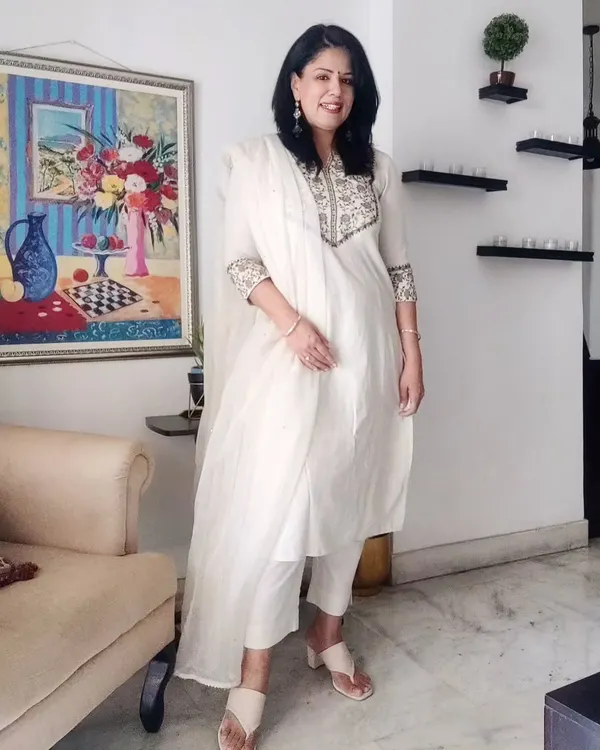 For a summer lunch, I chose this white cotton kurta set with delicate embroidery. It's paired with comfortable block heels and silver jhumkas. Whites and pastels are my essentials for beating the Delhi heat.