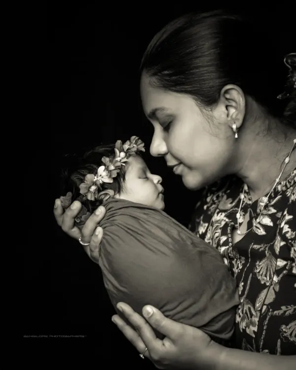 A mother's love, captured in a timeless black and white portrait. I love how this style strips away all distractions, focusing purely on the emotion and connection.