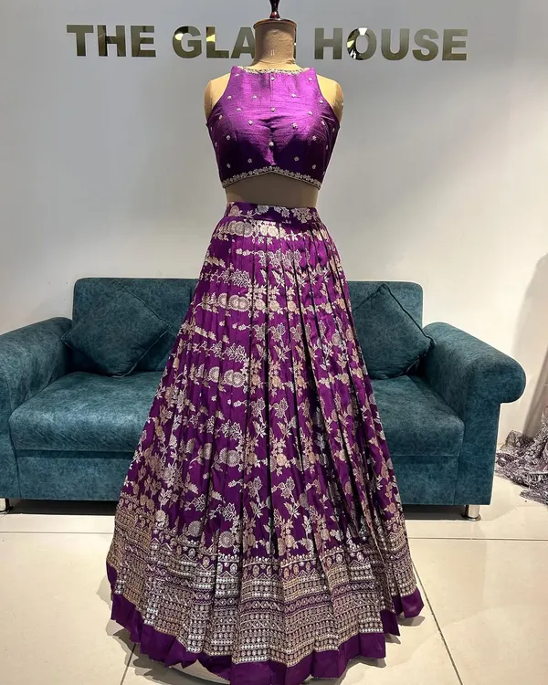 Grace in every pleat, tradition in every thread. This purple Banarasi lehenga is where modern style meets heritage.