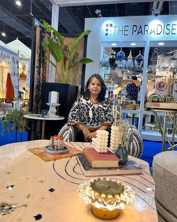 At our furniture extravaganza, ready to welcome visitors. Events like these are a whirlwind of creativity and craftsmanship, where I get to unveil stunning new collections that speak volumes without saying a word.