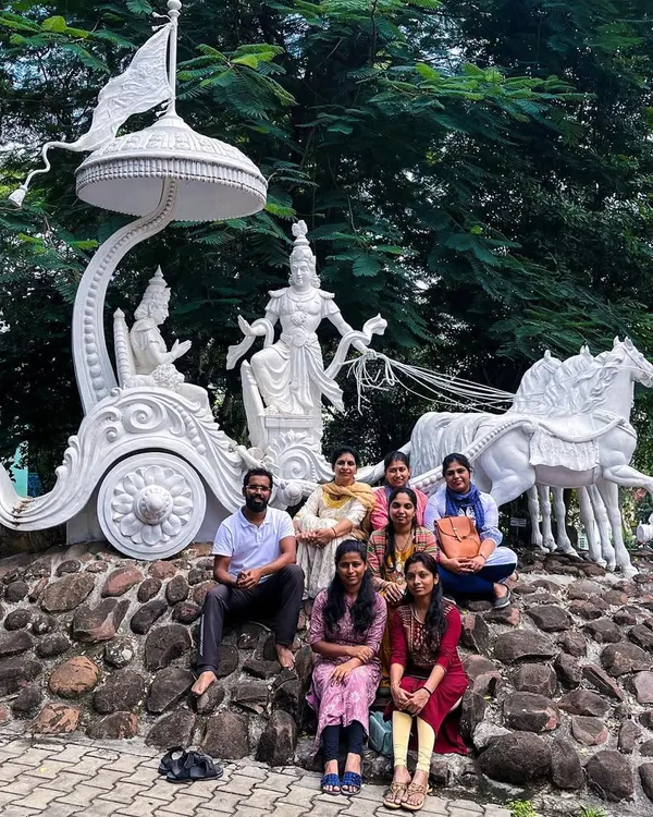 With my first batch of HITYOGA students at the S-VYASA campus, sitting before a beautiful sculpture of Krishna and Arjuna. This is where it all began.