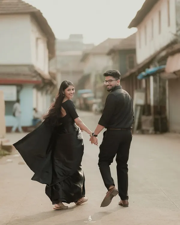 A classic "follow me" shot, leading the way through a charming old-world street. This style of photo is perfect for telling the story of your journey together.