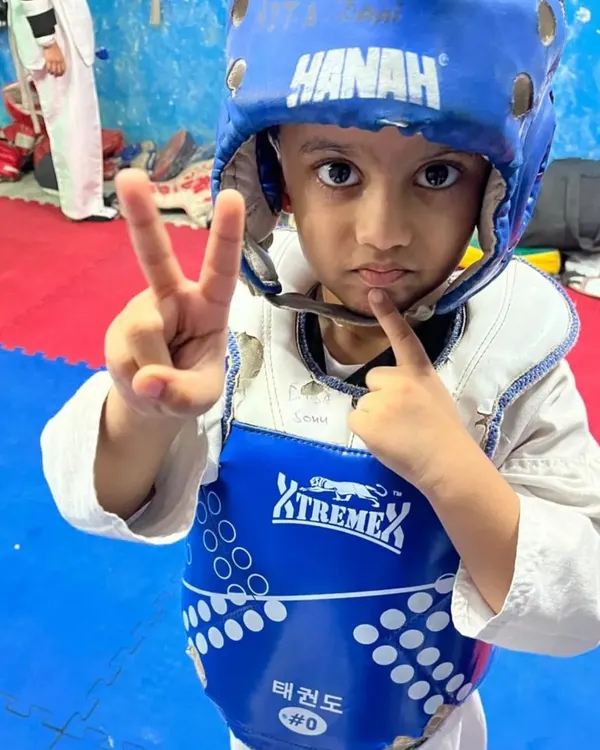 This little warrior is ready to train. We teach kids to be focused and disciplined from their very first day at the academy.