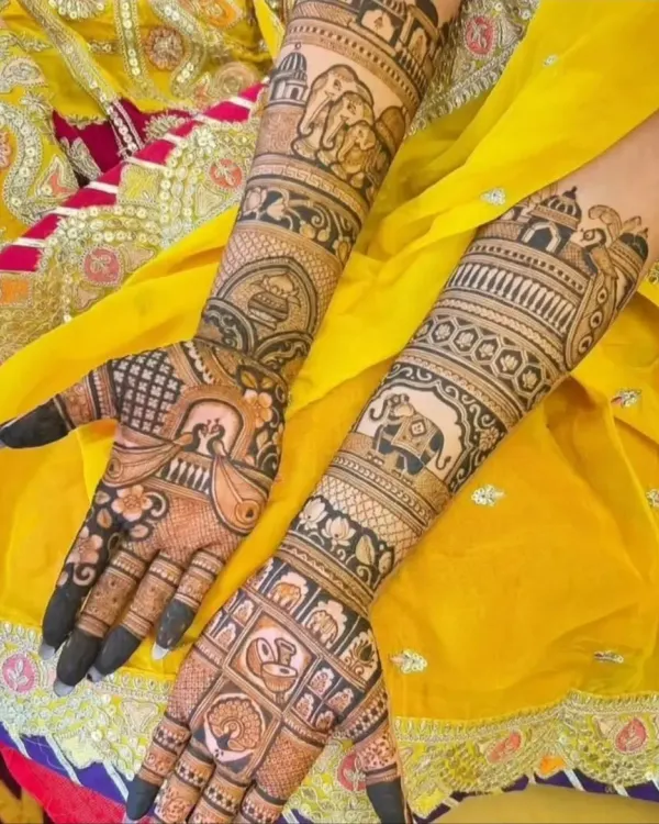 A classic full-arm Rajasthani bridal mehendi. This design features traditional motifs like elephants and paisleys, creating a rich and dense pattern perfect for a bride.