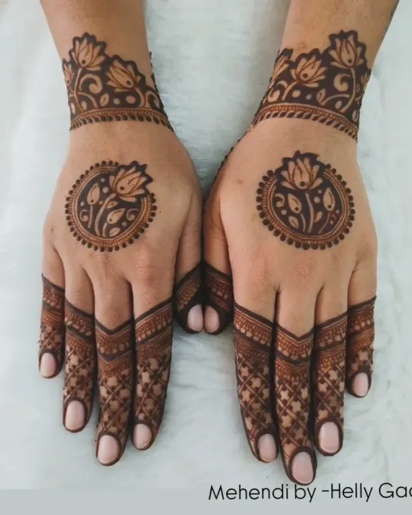 A modern and symmetrical back-hand design. Each hand features a central lotus mandala with detailed finger work and a matching lotus cuff, creating a clean and balanced aesthetic.