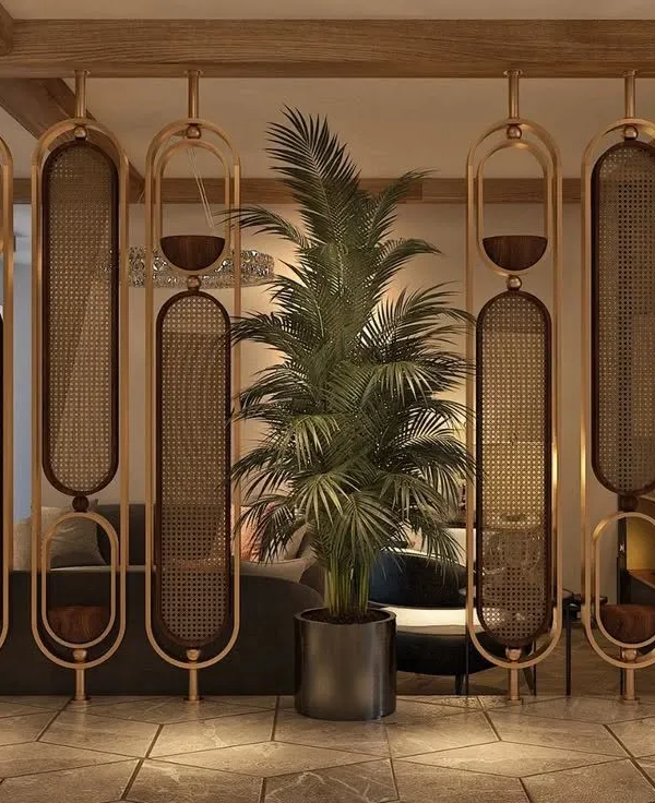 This stunning partition is made of metal frames with a powder-coated finish, holding panels of natural cane mesh. It divides the space while allowing light to pass through, adding a touch of organic modernism.