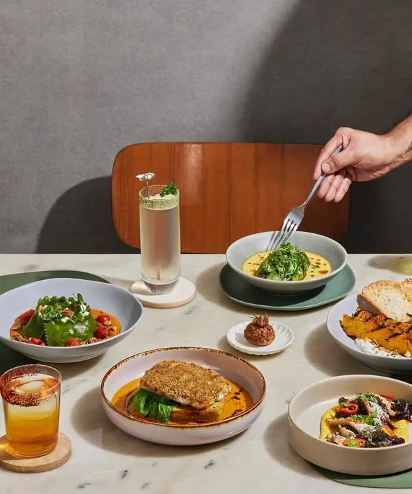 This is what a table at Plats looks like. A vibrant spread of our global dishes, creative cocktails, and the promise of good company. I believe food is a story, and this is a table full of them.