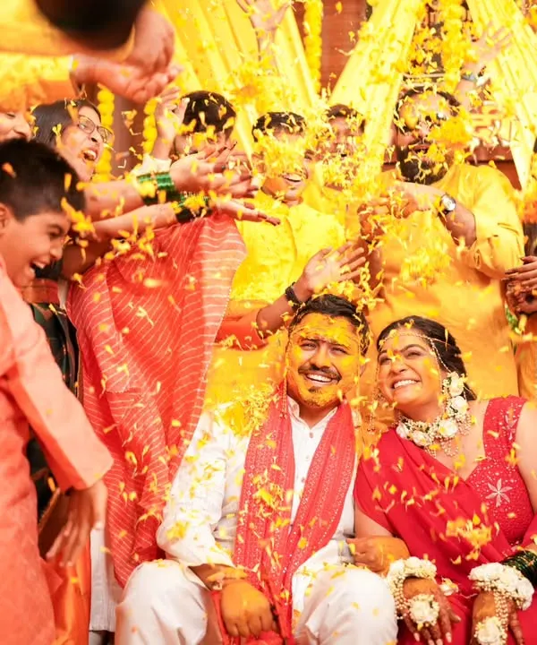 A shower of flower petals and blessings. This is the heart of the Haldi ceremony, a moment of pure joy and celebration that I love to capture.