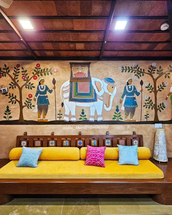 This is one of my proudest projects, a large-scale Cheriyal mural that transforms this living space. The artwork, depicting a temple procession, is fully integrated with the home's traditional decor, showing how a mural can become the soul of a room.