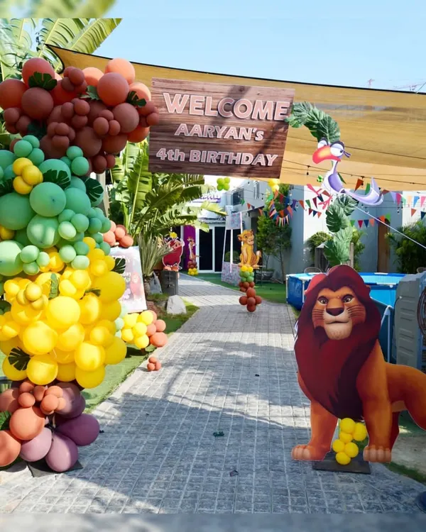 Welcome to a world of adventure. We transformed our outdoor space for Aaryan's 4th birthday with a complete Lion King jungle theme, starting with this grand entrance that sets the stage for fun.