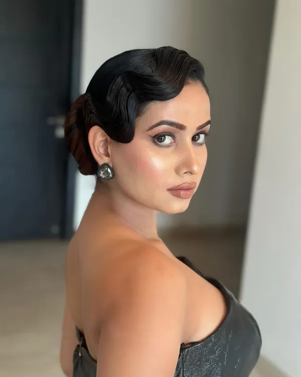 Vintage finger waves for a retro glam look. This is a highly technical and artistic style that creates a stunning, classic Hollywood effect.