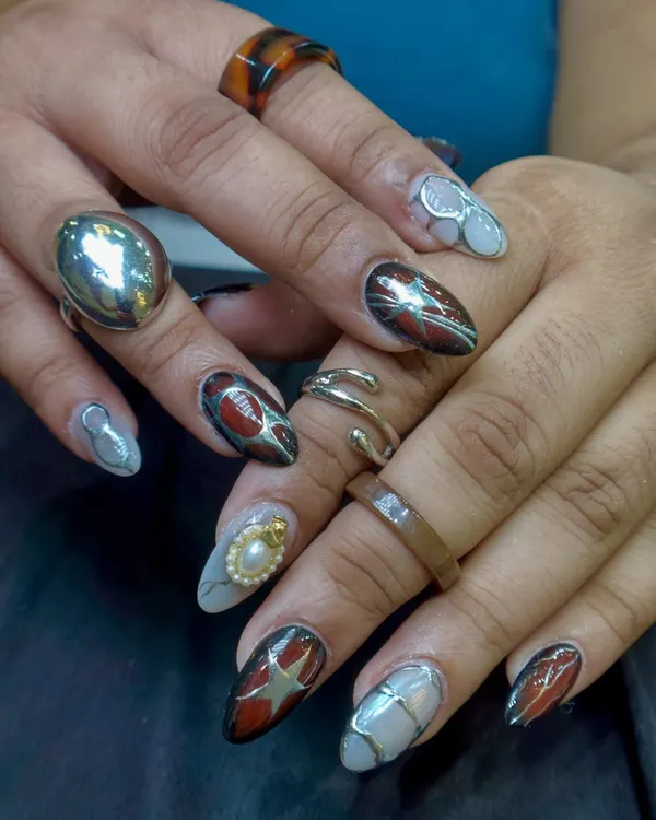 A bold, mixed-media design with stars, metallic accents, and a 3D pearl. This set is full of personality and artistic details.