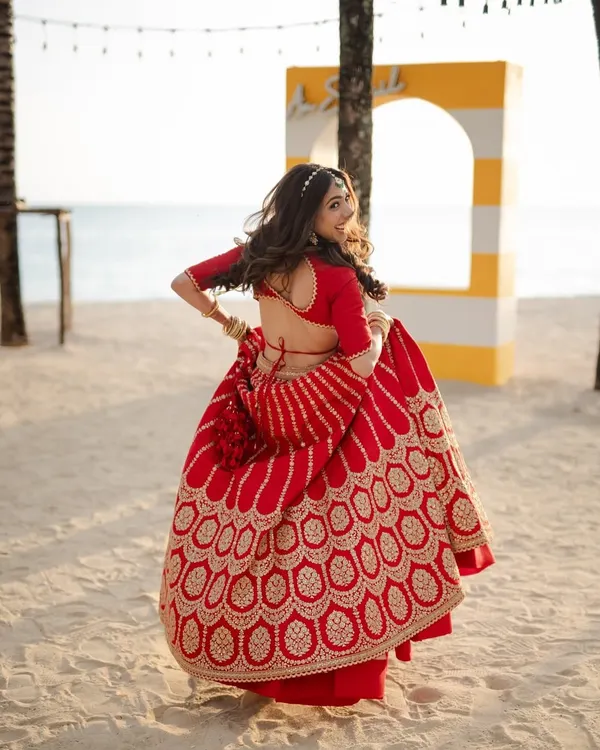 When the sea meets love! A beautiful shot of my Sabyasachi bride twirling on a beach in Thailand.