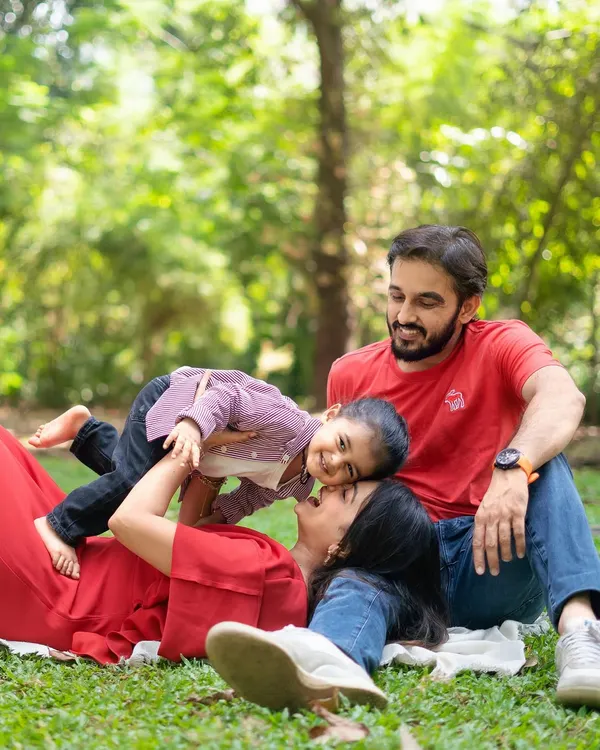This is what it's all about. A beautiful family enjoying a sunny day outdoors, lost in a moment of pure, unscripted laughter. I love capturing these candid interactions, where you forget the camera is even there.