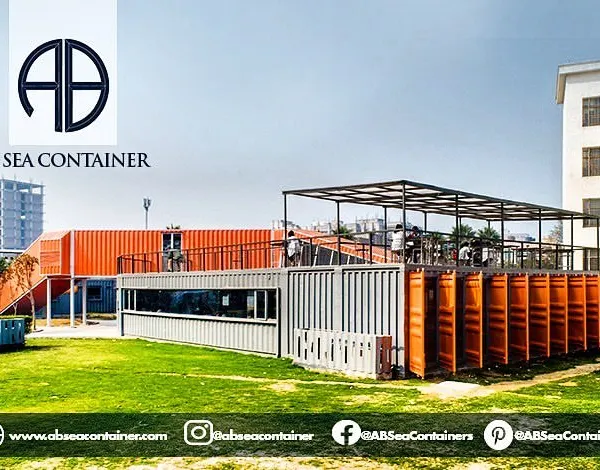 The 'Cafe Infinity' project, shown here in its urban setting, transforms industrial containers into a vibrant public space. The structure combines open-air terraces with enclosed dining areas.