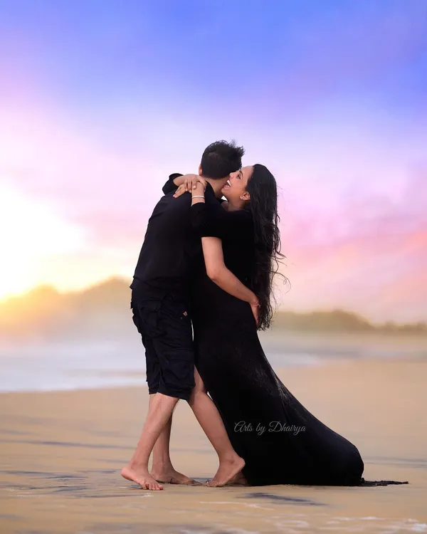 A beautiful moment captured against a vibrant Goa sunset. I love working with couples to create these dramatic, romantic portraits on the beach, using the magic of the evening sky to tell their story.