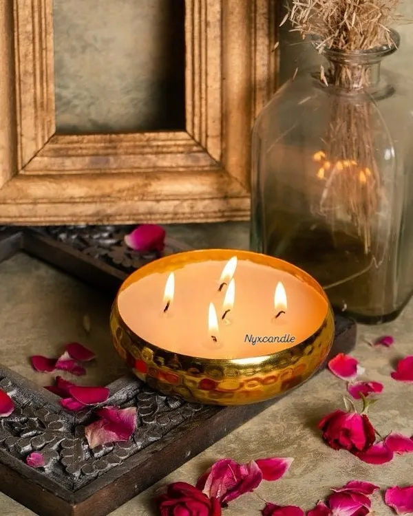 This is our signature multi-wick candle in a hammered brass urli, a piece that truly captures the essence of luxurious festive gifting. We crafted 650 of these for Monte Carlo's corporate Diwali gifts, each filled with scented soy wax and topped with delicate rose petals. It’s a statement piece that leaves a lasting impression.