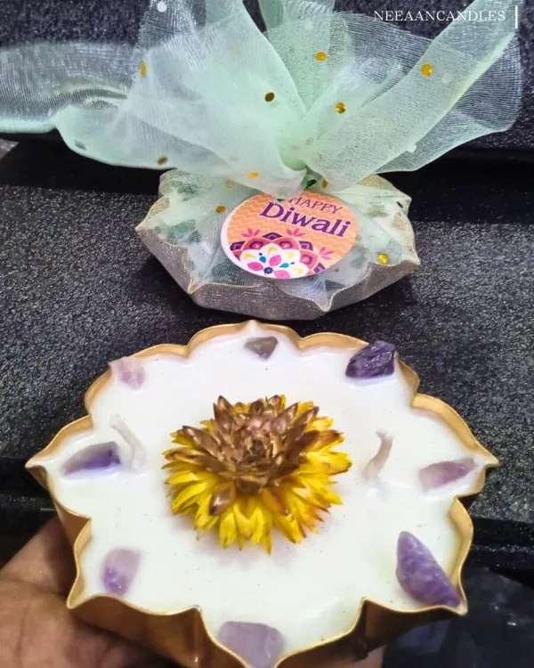Lighting up hearts this Diwali with handcrafted candles. This gift set includes a beautiful floral urli candle with amethyst crystals, ready to spread positivity and light.