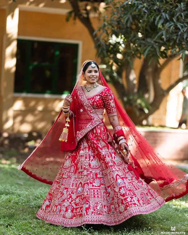 I love capturing the pure joy and elegance of a bride on her wedding day. This twirl shot shows the beautiful movement of the lehenga and the bride's radiant smile.