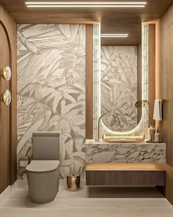 This luxurious powder room combines rich wood paneling with a tropical-print accent wall. A floating marble vanity, backlit mirror, and elegant wall sconces complete the sophisticated look.