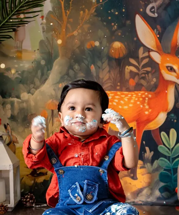 A joyful first birthday celebration with a woodland-themed cake smash. I provide a complete setup, including the backdrop, props like the 'ONE' marquee lights, and a custom outfit to make your baby's milestone truly special.