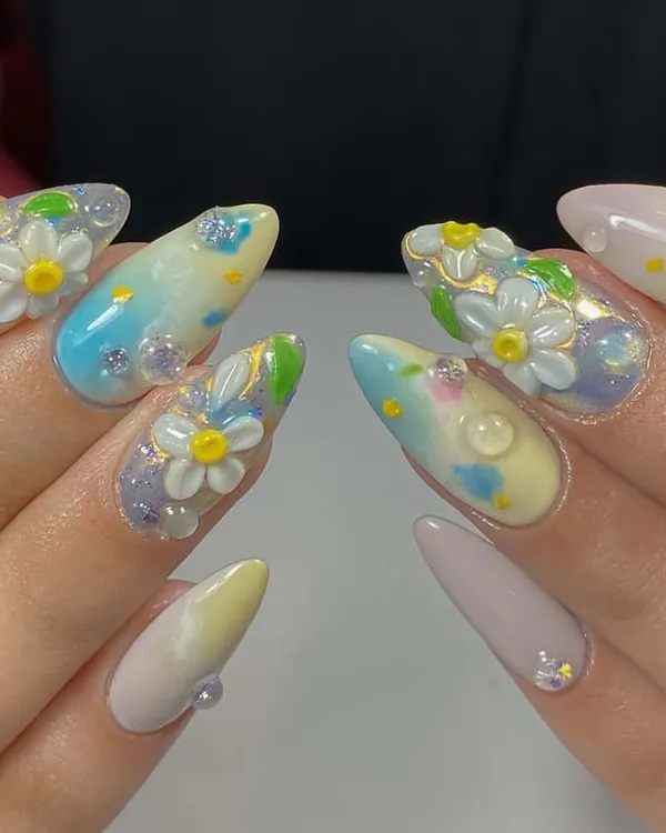 A garden on your fingertips. This adorable set features hand-sculpted 3D daisies, a pastel watercolor background, and tiny dewdrop effects.
